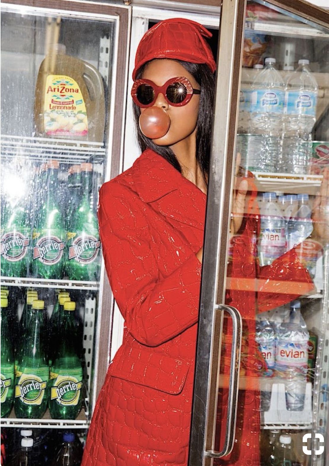 Red-coated bodega girl with bubble gum — candid consumer moment