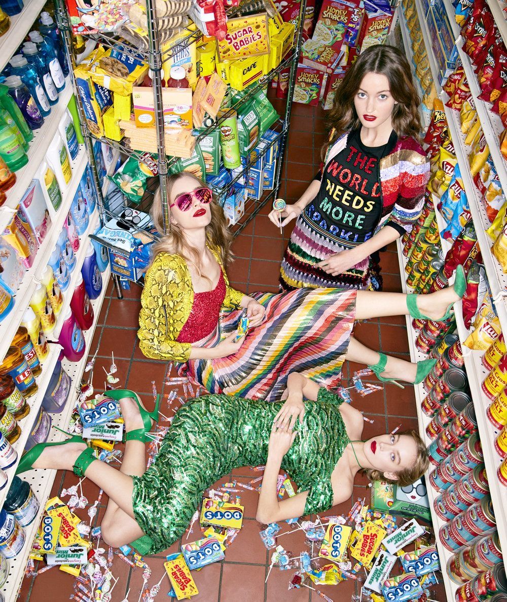 Vogue-style couture girls in a corner store — high fashion meets haul energy